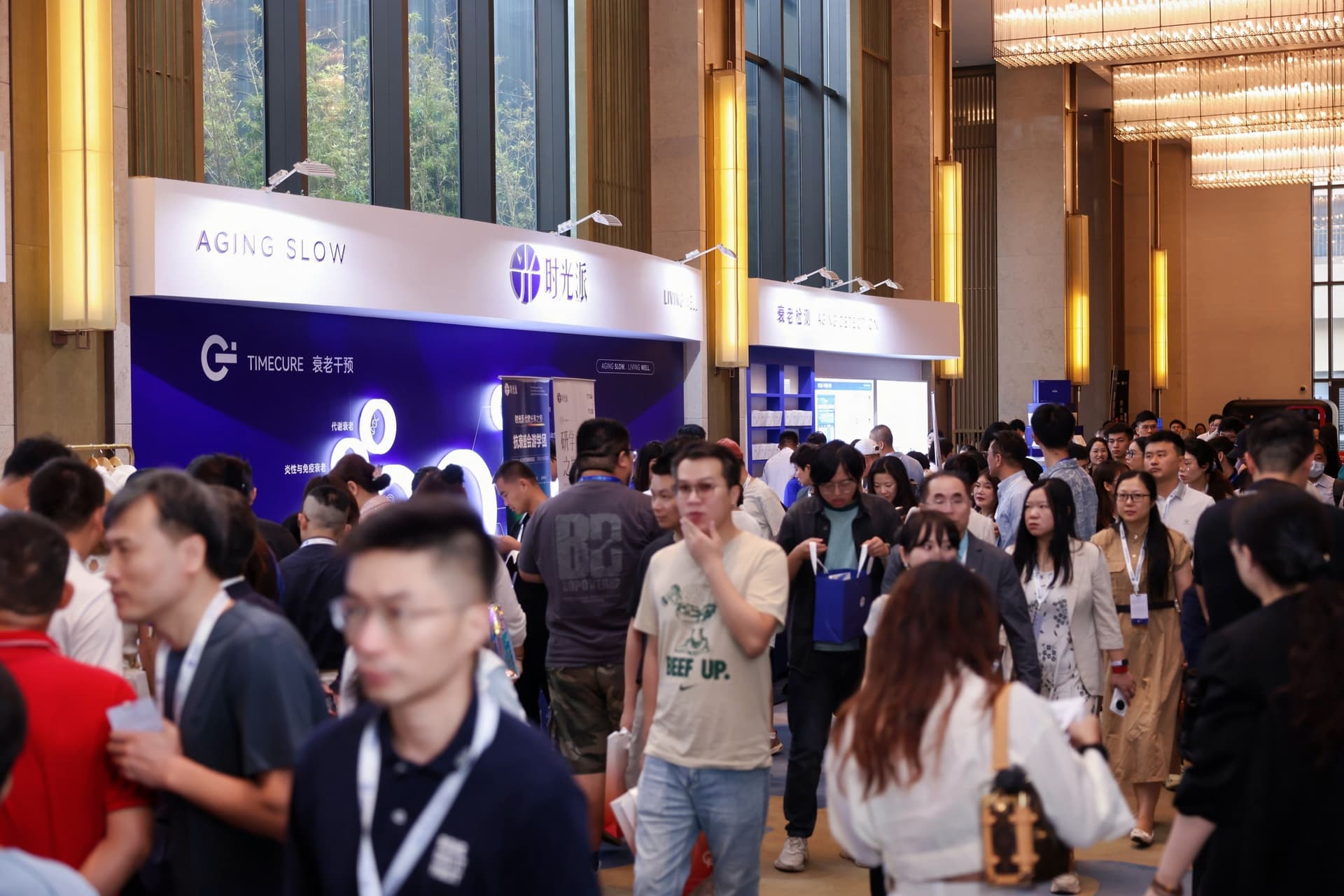 Attendees Exploring Exhibition Booths During the Coffee Break